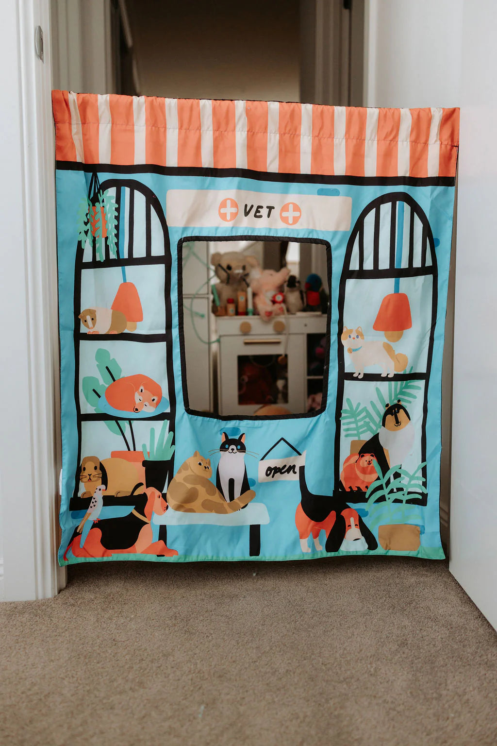 Kids reversible vet and pet shop play panel with doorway hanging setup