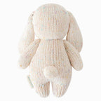 Back view of Cuddle+Kind baby bunny (confetti) hand knit stuffed toy showing long floppy ears and knit texture