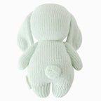 Back view of Cuddle+Kind baby bunny hand knit stuffed toy showing long ears and knit texture