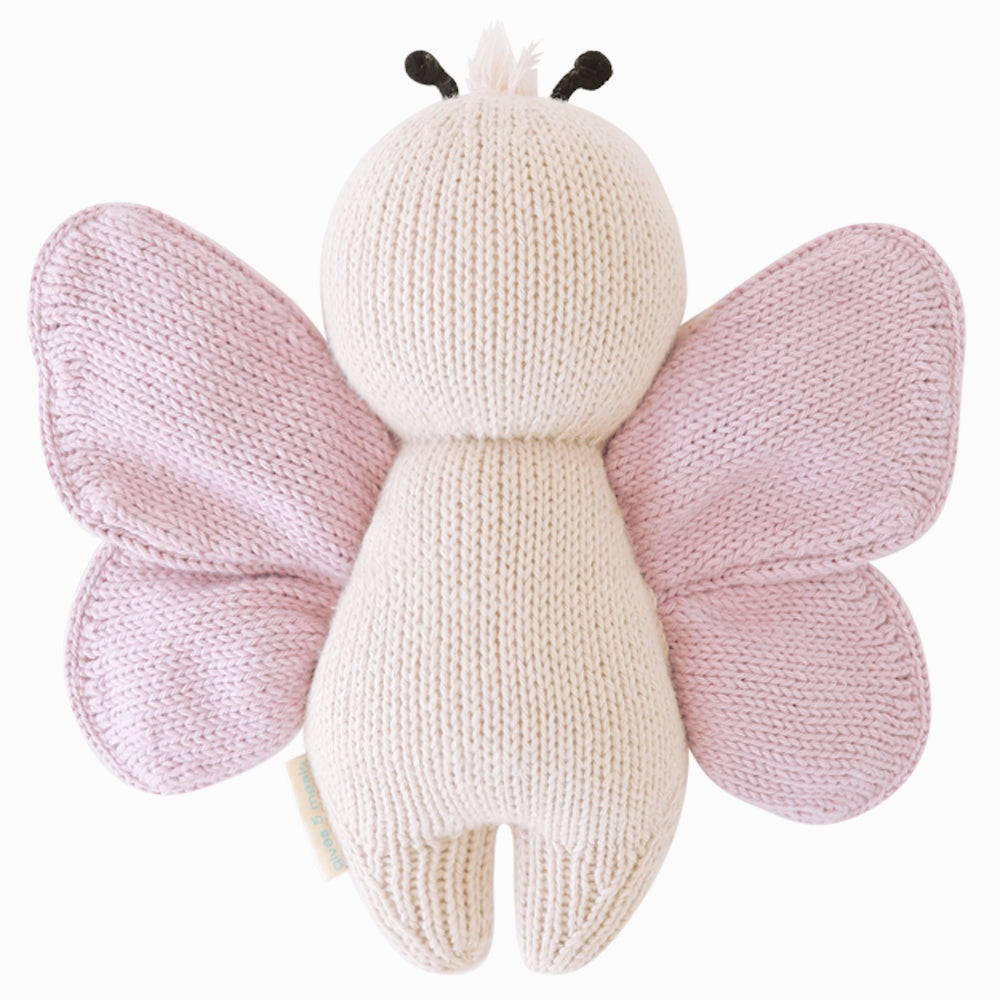 Back view of Cuddle+Kind baby butterfly hand knit stuffed toy showing soft fabric wings and knit texture
