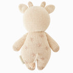 Back view of Cuddle+Kind baby giraffe hand knit stuffed toy showing small tail, ears and knit texture