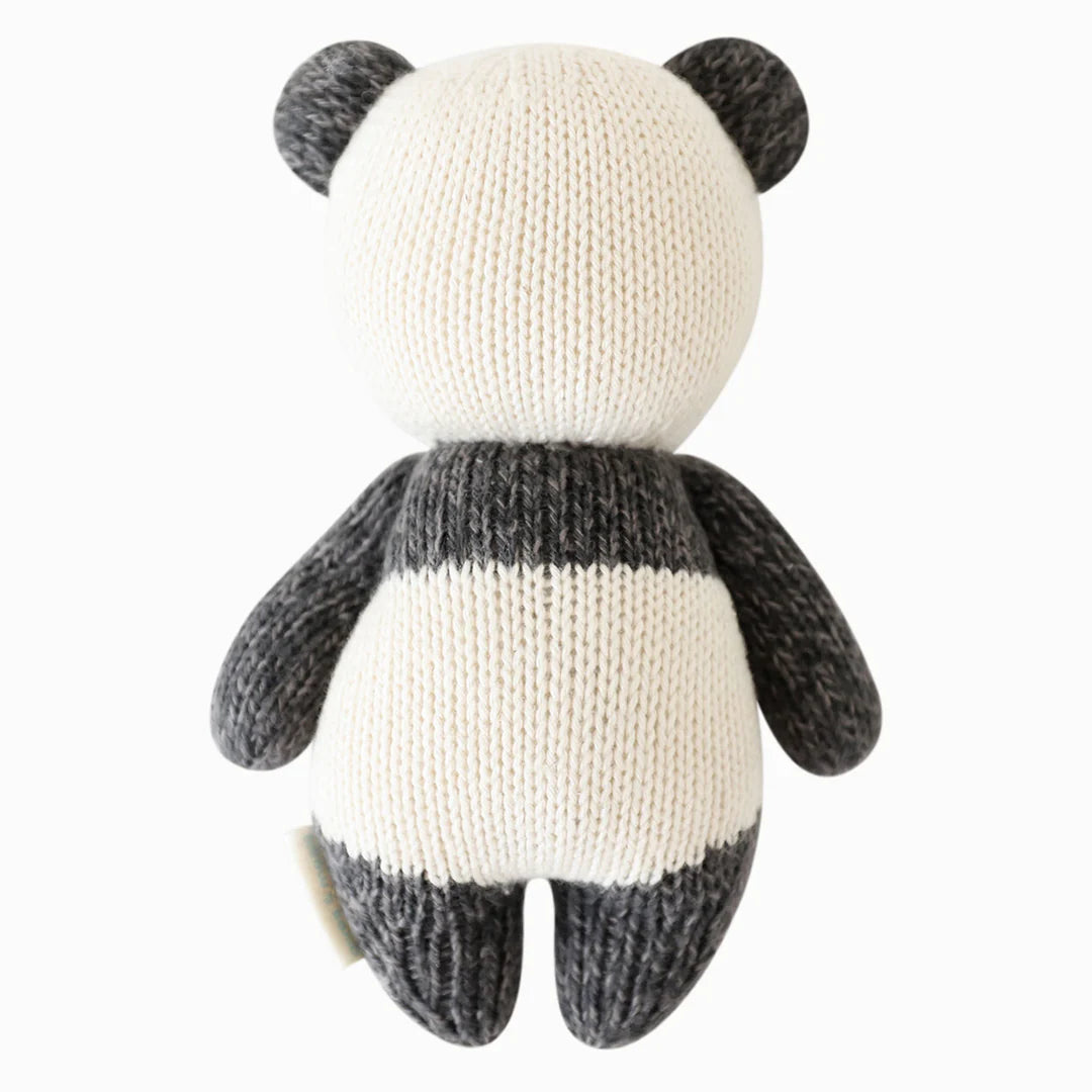 Back view of Cuddle+Kind baby panda hand knit stuffed toy showing rounded ears and tail
