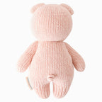 Back view of Cuddle+Kind baby piglet hand knit stuffed toy showing rounded ears and curly tail