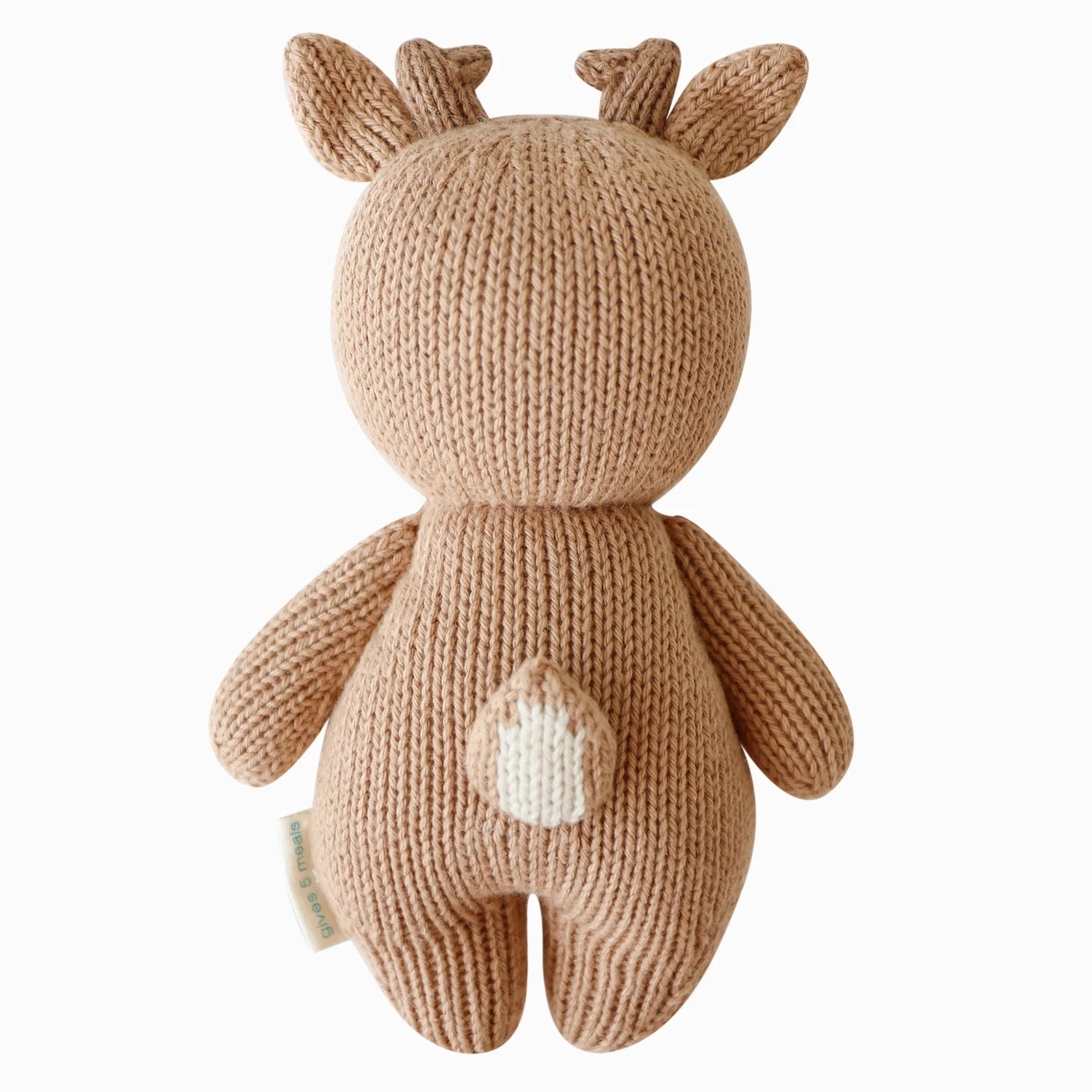 Side view of Cuddle+Kind baby fawn knit plush toy showing tail and stitched details