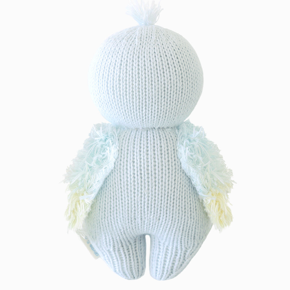 Back view of Cuddle+Kind baby parrot hand knit stuffed toy showing wings and knit texture