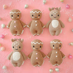 Hand-knit gingerbread doll with white icing details