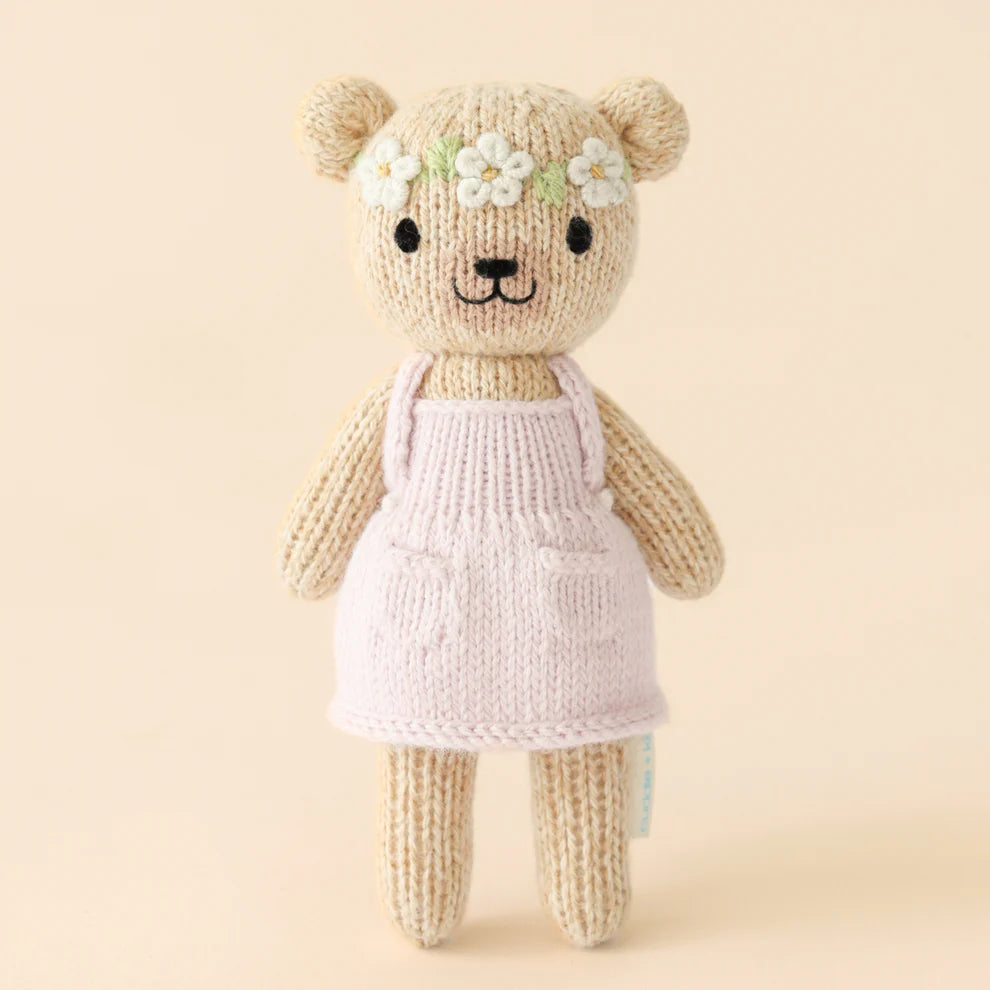 Handmade bear doll in cream dress
