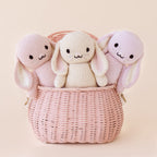 Cuddle+Kind baby bunny knit plush toy styled with matching hand knit baby animals in pastel nursery setting