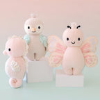 Cuddle+Kind hand knit baby animal plush toy collection displayed together in soft pastel colours