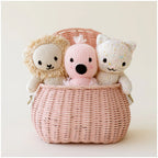 Cuddle+Kind baby kitten knit plush toy styled with matching hand knit baby animals in nursery setting including baby flamingo and baby lion