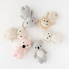 Close up of Cuddle+Kind baby kitten confetti knit plush toy showing stitched face and colourful speckled details including baby koala, baby lion, baby elephant, baby flamingo and baby lamb