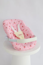 photoshoot of strawberry picnic Dolls Car Seat Capsule by tiny harlow 