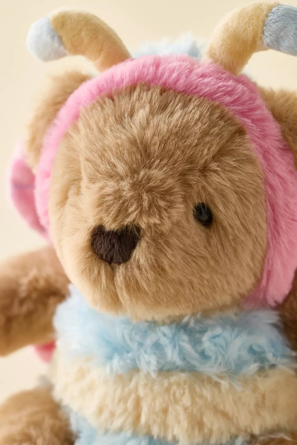 close up of bear in a butterfly costume dress up like similar to jellycat. stock image - brand is Mon Ami. very cute plushy soft toy
