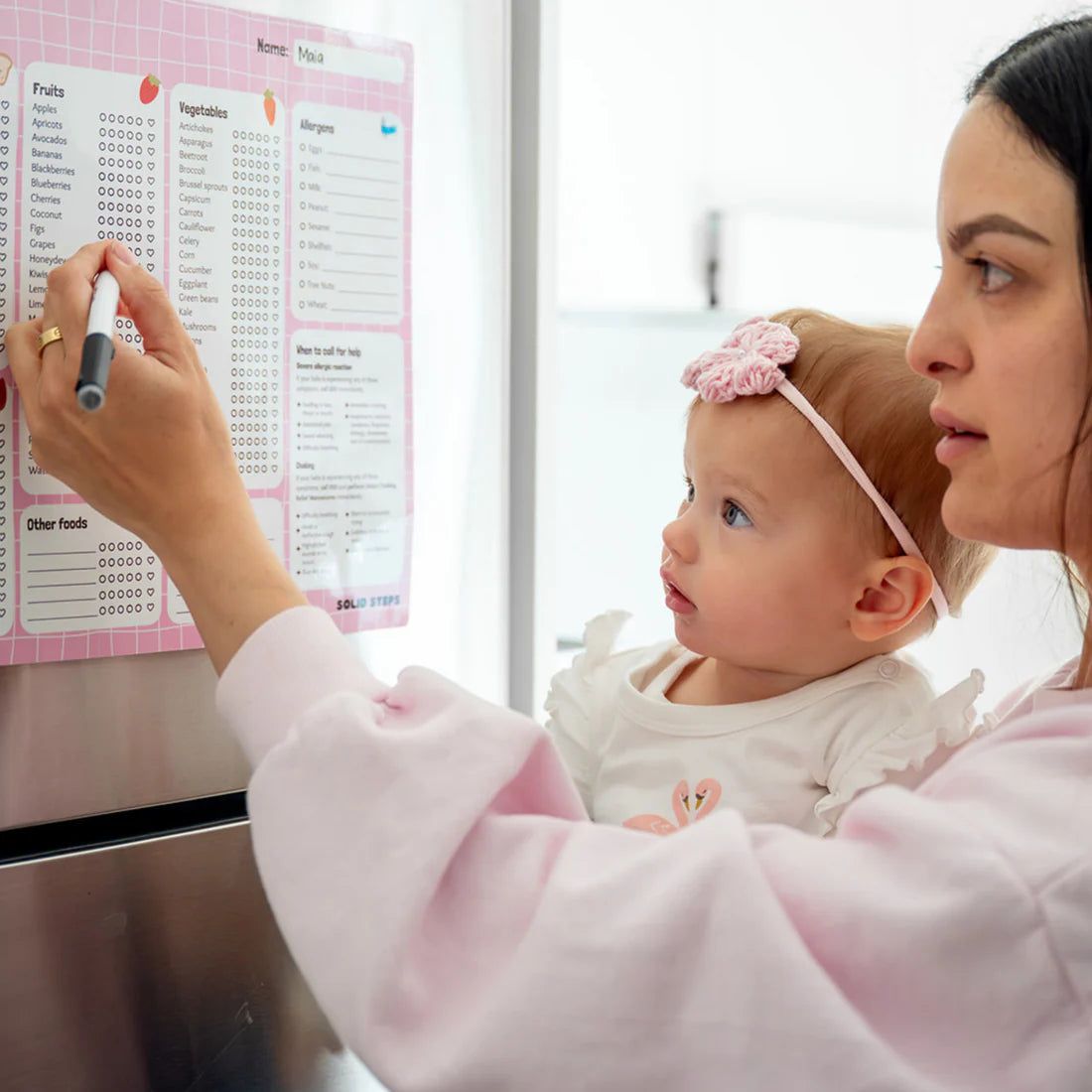 ticking off By the brand solid steps, these are baby first foods and allergens A3 fridge magnet for staring solids and ticking off first foods tracker. is a whiteboard material and comes with whiteboard marker. The colour is pink