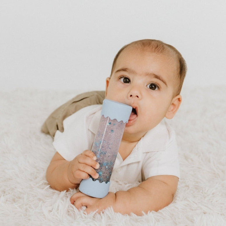 Baby Calm Down Bottle in Soft Blue with floating star glitter sensory elements for tummy time