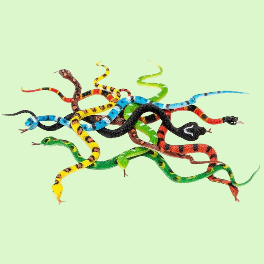 A pile of colorful toy snakes with black, red, yellow, blue, and green patterns, arranged on a plain white background.