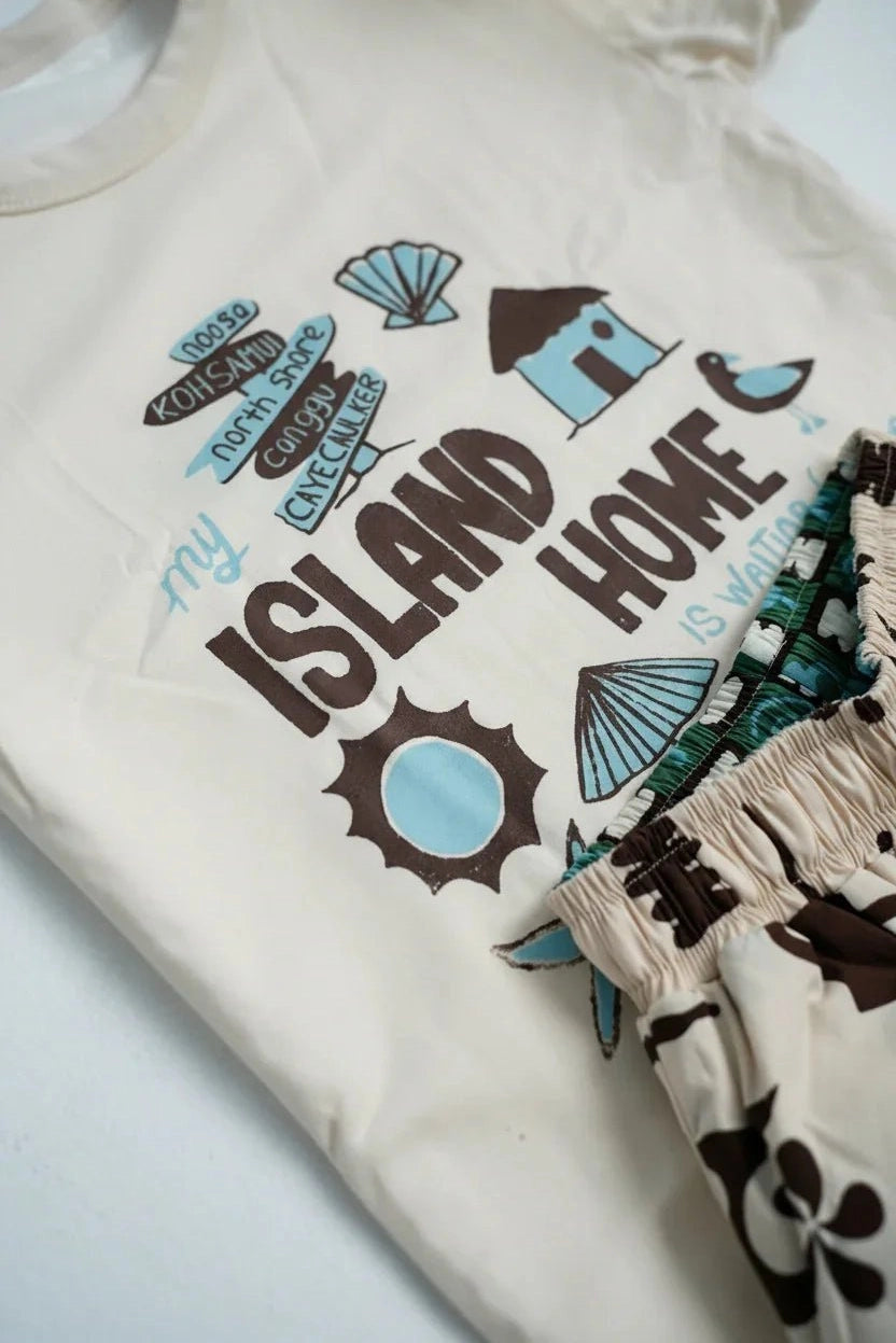 White reversible kids t-shirt with travel-inspired graphic print