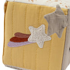 Baby sensory cube featuring colourful space-themed elements and tactile details