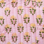 quilted cotton travel bag in pink with small floral pattern