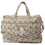 quilted floral overnight bag with carry handles and shoulder strap