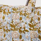 floral quilted bag with gold hardware and zip closure