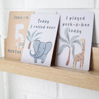 milestone cards by lively living to track babies age and milestones. great for photos and theme is wild safari. card pictured reads today i'm 5 months old, today i rolled over, i played peek a boo today