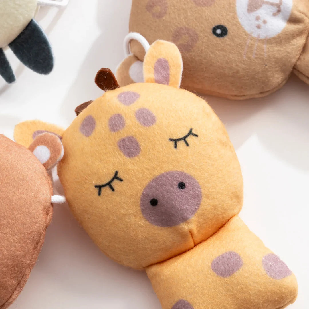 closer look of giraffe in Wild Safari nursery bunting decoration by Living Textiles. A soft felt garland perfect for nursery styling and kids room decor