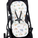 Dragon print pram liner fitted inside stroller seat showing universal strap slots and soft padded coverage
