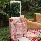 Close up of strawberry print on Olli Ella Dozy Dinkum doll