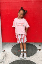 Lokal Folk Traveller Tee featuring yellow graphic print and pink slogan design