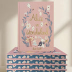 edges Alice in Wonderland collector’s edition hardback book with blush pink illustrated cover, gold foil lettering and sprayed heart cards page edges by Lewis Carroll. wordsworth collectors limited edition
