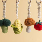 Living Textiles broccoli and tomato mini market toys hanging from a play gym