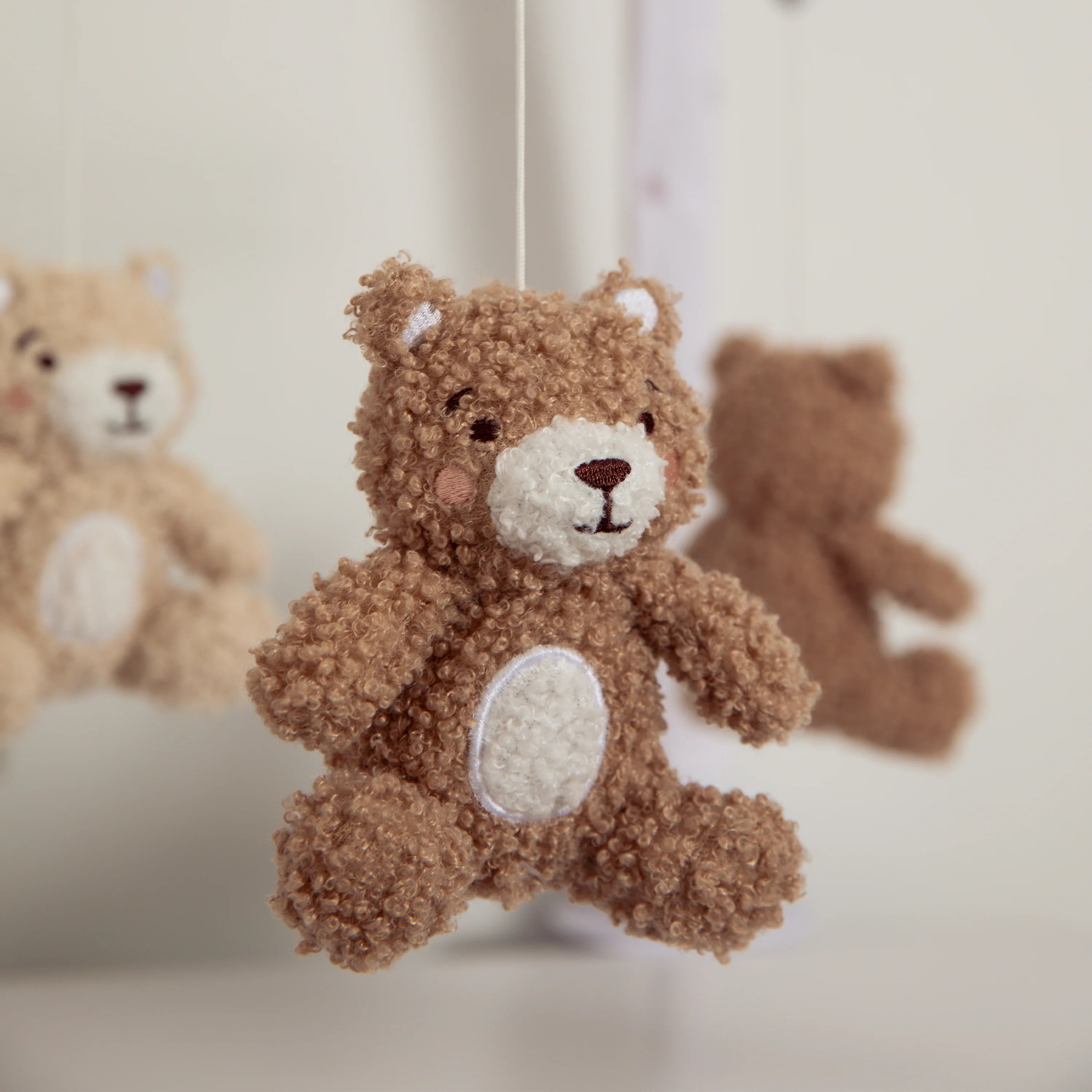 Brown teddy bear with a blurred background