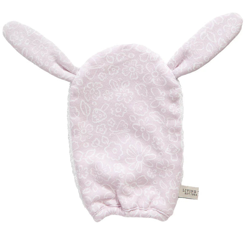 Pink baby bath mit with bunny ears on a white background