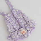 baby dolls carrier made by tiny harlow - empty to show product for pretend play, the print is lilac daisy