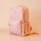 side view of Fox & Fallow backpack for kids, perfect for school, daycare and everyday use. Spacious, practical and designed for little adventures. Personalisation of embroidery with name also available on bags in 2 placements. This print is peach checks