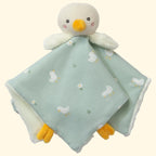 Plush duck toy with a green blanket featuring duck patterns on a white background