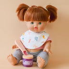 redhead mini coletto doll showcasing the tiny tummies pretend play doll food jars that disappear like real food. brand is tiny harlow and tiny tummies food jar flavour is  grape jelly