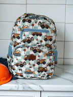 front view of Mini & Mum kids backpack with insulated interior for daycare and outings. can be personalised with childs name. this print is digger dreaming. blue or sage checkers with digger construction trucks vehicles over it