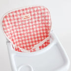 close up of pink gingham highchair for dolls made by tiny harlow