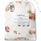 Snuggle Hunny Diggers & Tractors organic bassinet sheet in matching drawstring bag featuring playful digger and tractor vehicle print