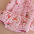 close up of baby dolls carrier made by tiny harlow - empty to show product for pretend play, the print is
