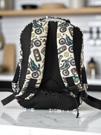 back view of Mini & Mum kids backpack with insulated interior for daycare and outings. can be personalised with childs name. this print is motorbike mania with motorbikes and wrenches, helmets, lighting bolts and smiley faces