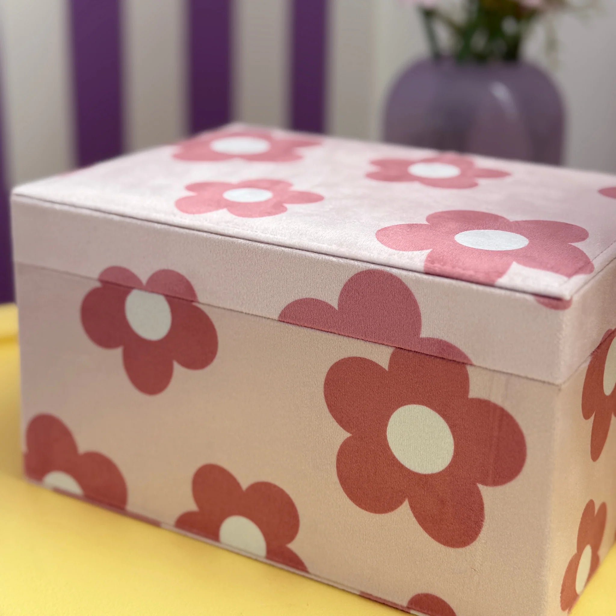 jewellery box styled on bed with pastel bedroom decor