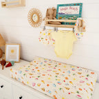 Beach Fun organic change pad cover on a baby change mat in a cheerful beach themed nursery setting