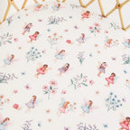 Fairy Garden organic cotton bassinet sheet laid flat showing whimsical fairies, flowers and soft pastel garden illustrations