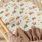 Diggers and tractors print organic cotton bassinet sheet laid flat showing construction vehicles on soft breathable jersey fabric