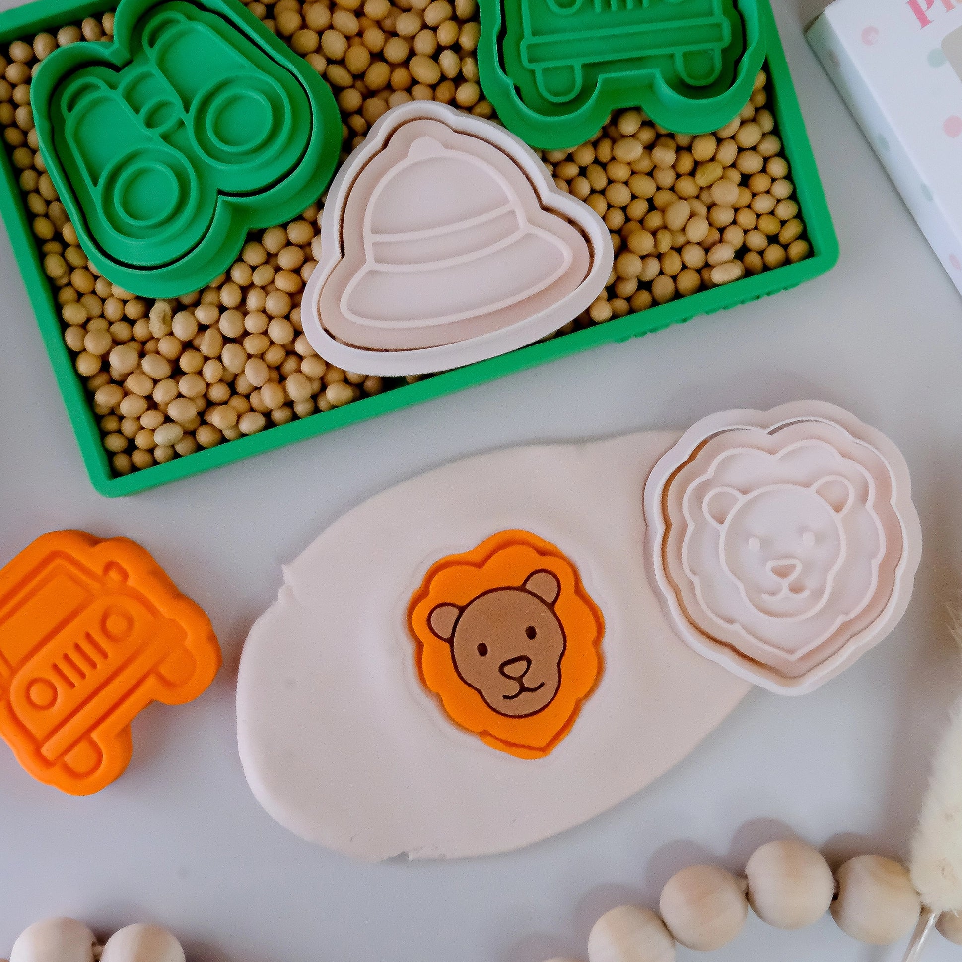 stamp of image of playdough/clay stamp and cutter. Eco-friendly sensory play tool by brand playsense perfect for creative and imaginative play. can also be used for cookies and baking. pictured is lion