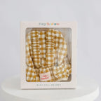 baby dolls carrier made by tiny harlow in packaging to show good for gifting and pretend play, the print is mustard gingham