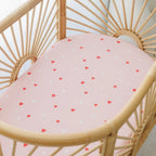 Organic cotton bassinet sheet in pink with heart print for baby bedding
